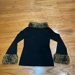 Black sweater with fuzzy cheetah collar. 
Size: XL does have stretch 
Brand: INC